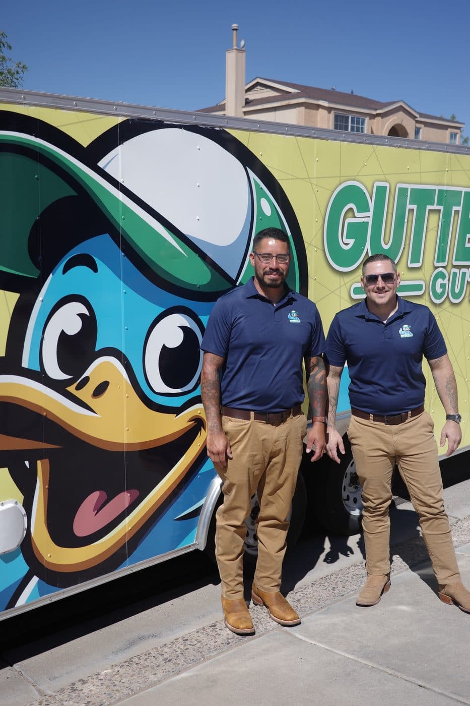 The Gutter Duck Gutters team in front of their branded trailer in Albuquerque